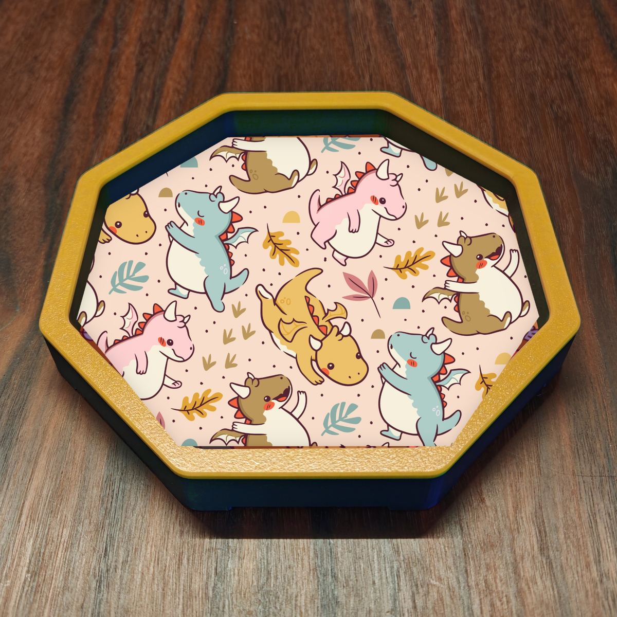 Pastel Cute Baby Dragons dice tray with a yellow octagonal frame on wooden tabletop