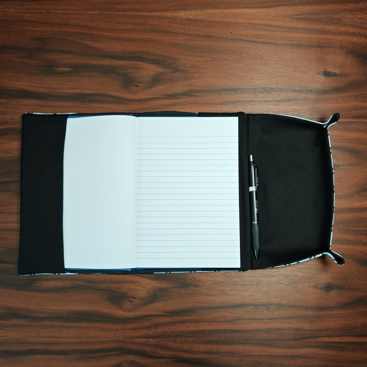 Open A5 notebook dice tray with notebook, pen in holder and empty dice tray